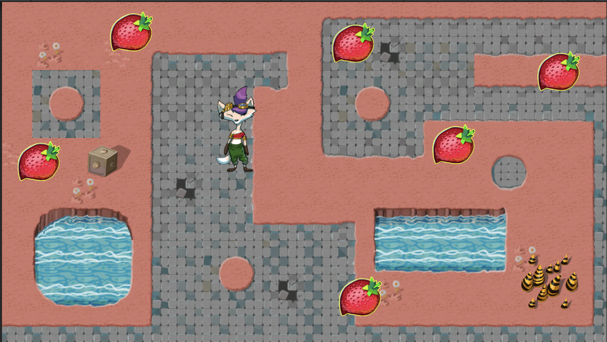Ruby character along with several assets placed on the game map, including a box decoration, a damage zone, and multiple strawberry collectibles.]