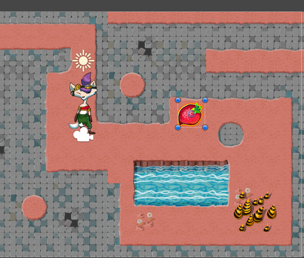 Ruby character, a damage zone, and a strawberry collectible placed on the game map. The strawberry collectible is selected.