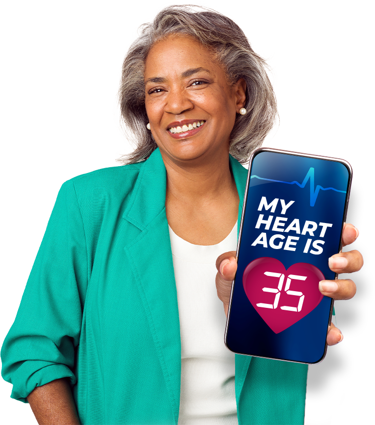 Woman in her fifties holding a phone that reads my heart age is 35
