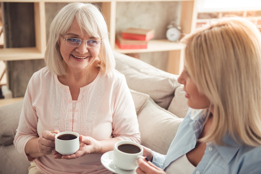Senior woman having conversation with adult daughter