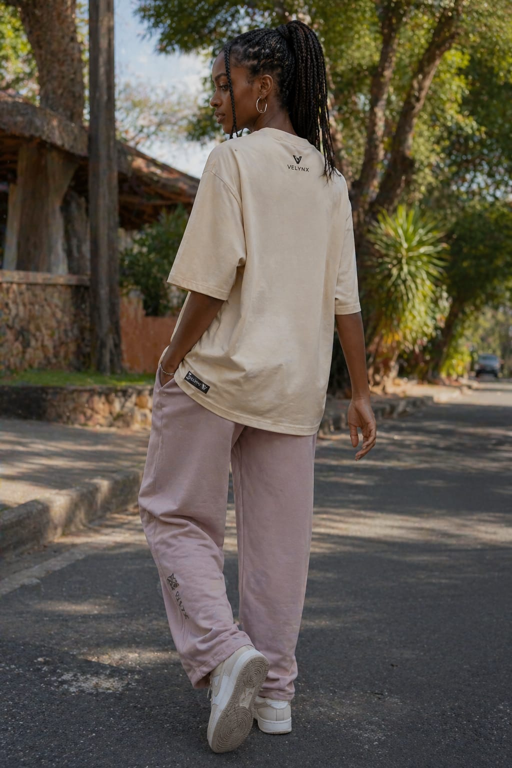 Female model in VELYNX urban casual wear
