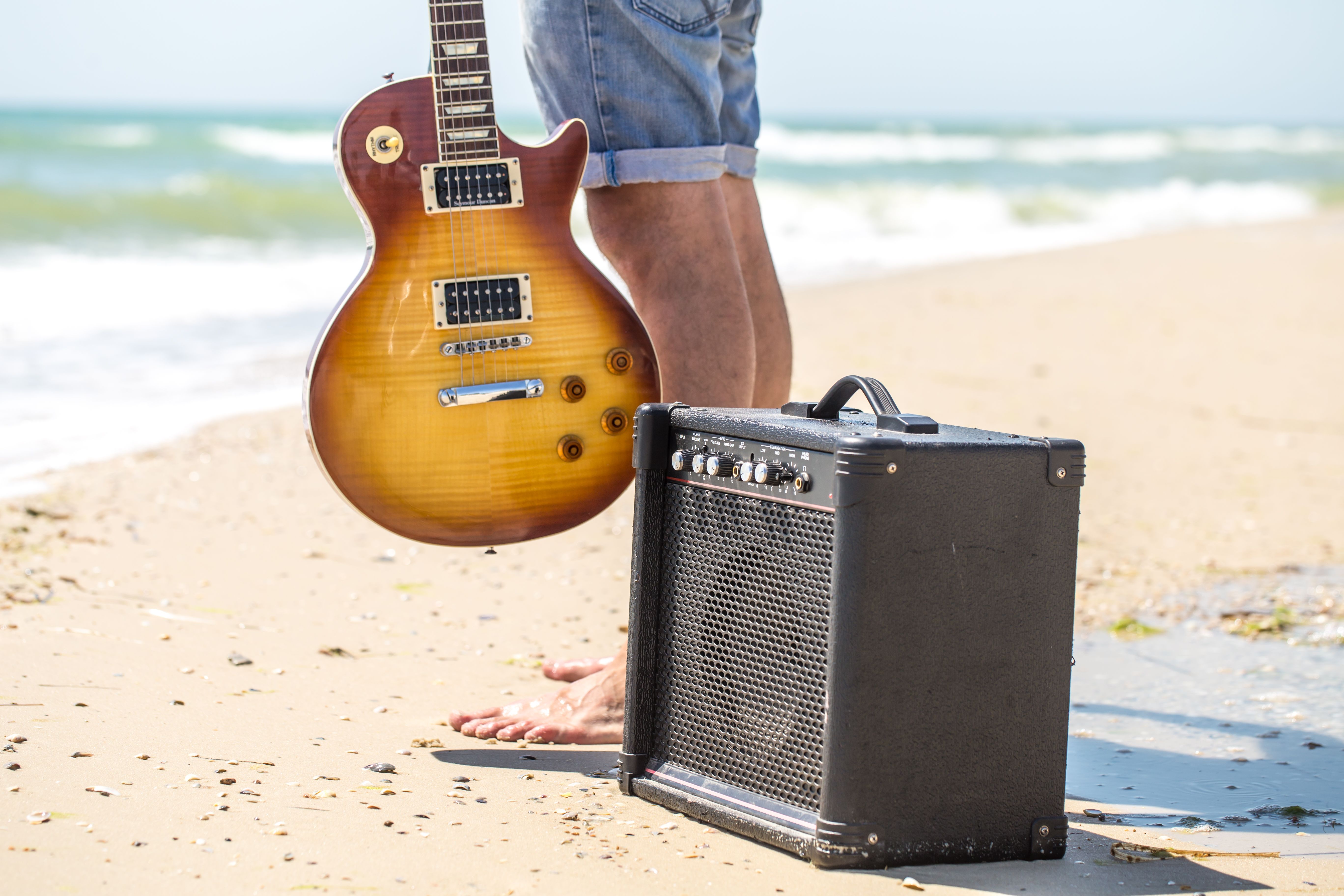 A musician near the sandly beach