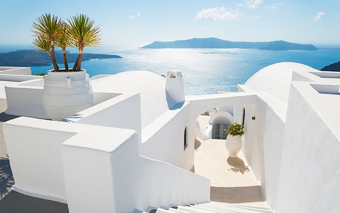 Santorini view with white Churches and houses