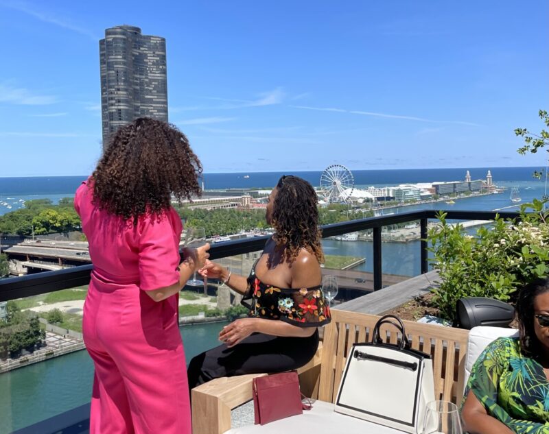 Two women posing on the terrace at Miru