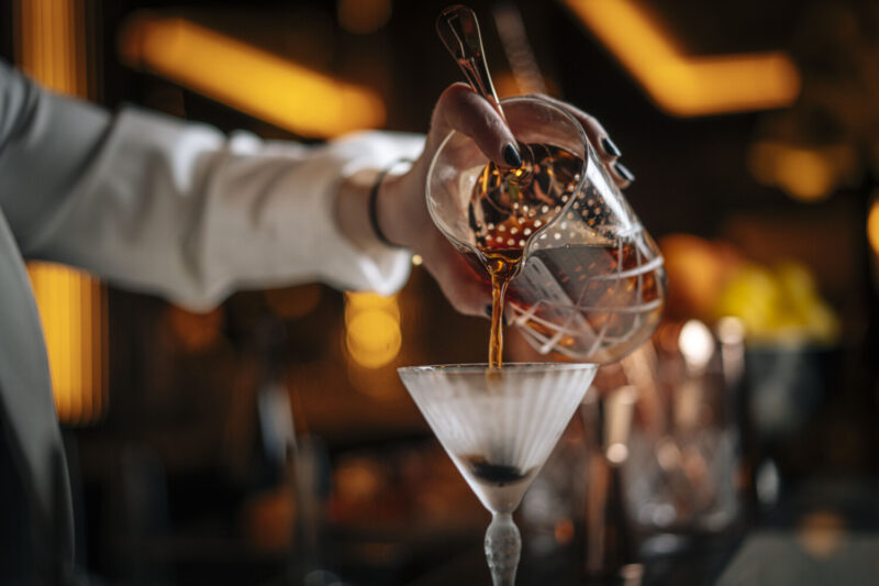 Bartender pouring the Dita cocktail at Bar Tre Dita