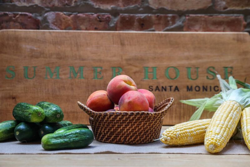 Cucumbers, peaches, and corn ready for pickling at Summer House 