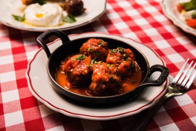 prime beef meatballs in marinara sauce with parsley