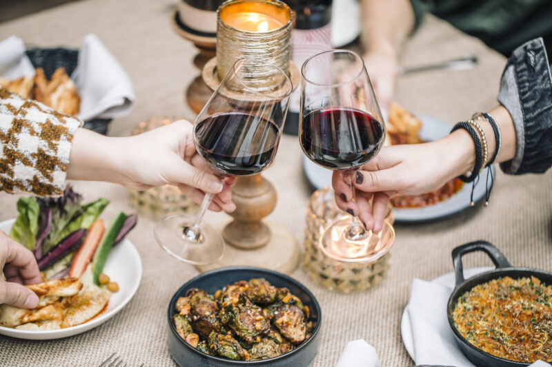 Aba wine glasses and food on the table