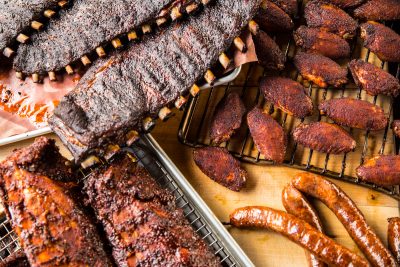 Variety of BBQ meats like chicken, ribs and sausage