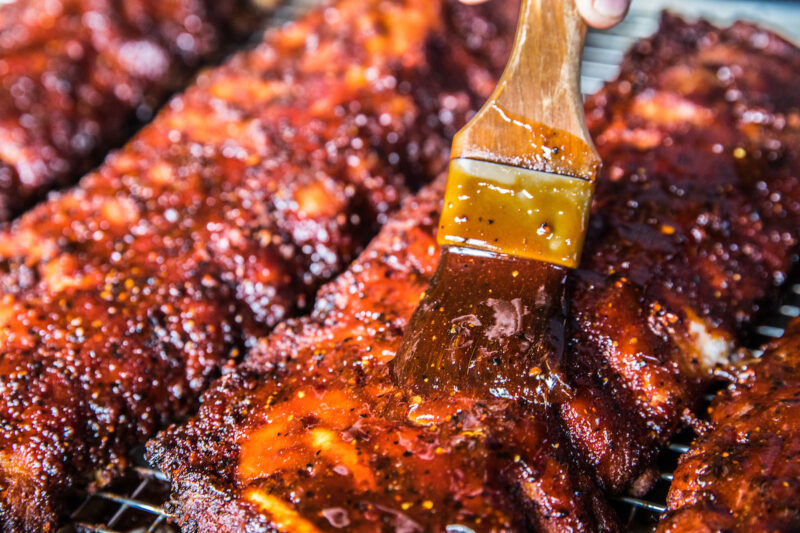 Bub City BBQ sauce being brushed over ribs