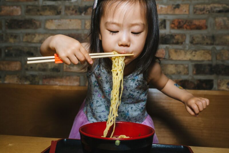 Child eating noodles at Ramen-san