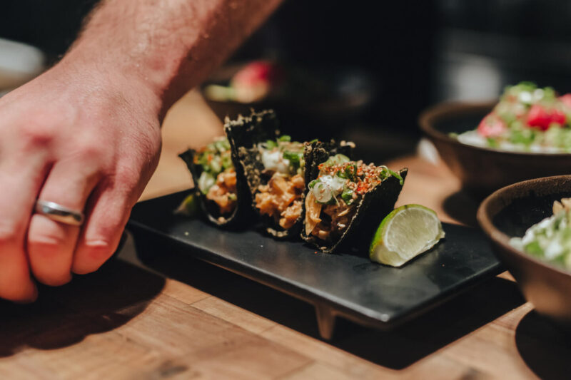 Platter of Tako Tacos from Sushi San with other side dishes