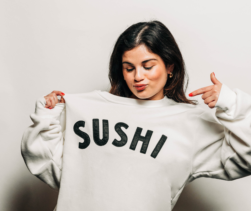 Model wearing crewneck sweater from Sushi-san