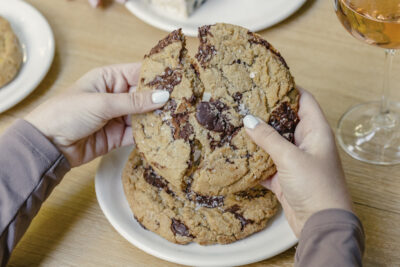 Summer House cookie being broken apart