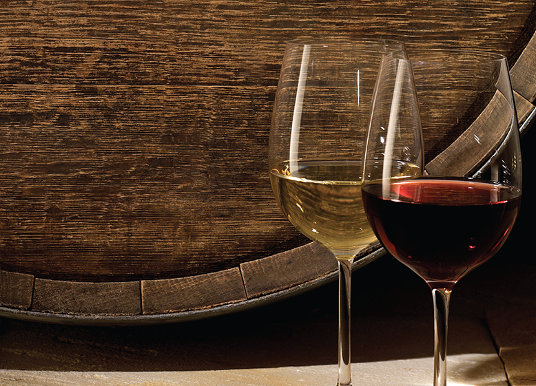 White and red wines next to a barrel at Wildfire