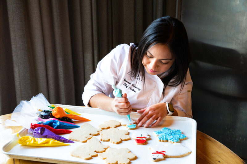 Chef Yasmin Guttierez decorating cookies