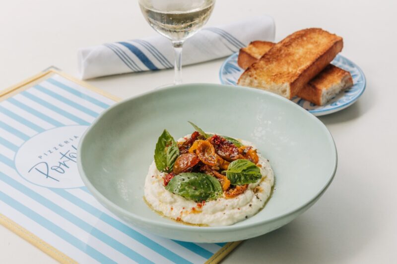 Pizzeria Portofino Sundried Local Tomatoes, Whipped Stracciatella, Sicilian Olive Oil, Artisan Focaccia.