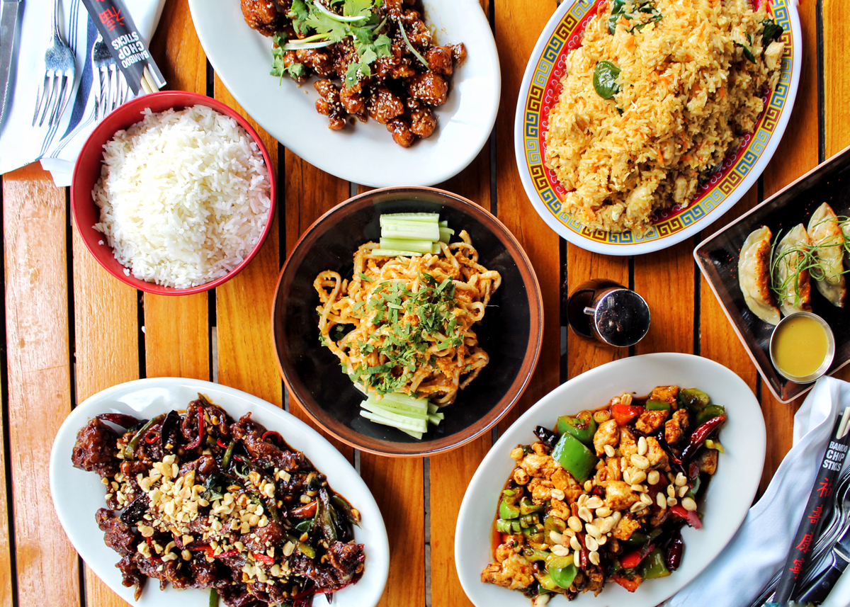Overhead shot of a variety of Chinese food dishes from Ben Pao