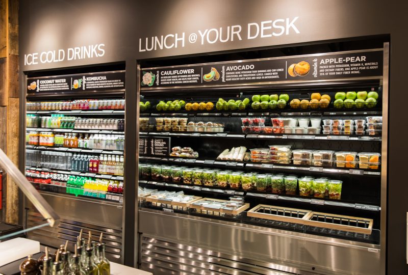 Reach-in cooler full of fruits and packaged meals