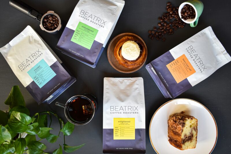 Bags of Beatrix Coffee Roasters coffee and pastries