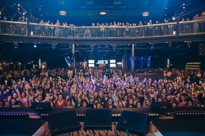 Photo from the stage looking out over a crowd of people