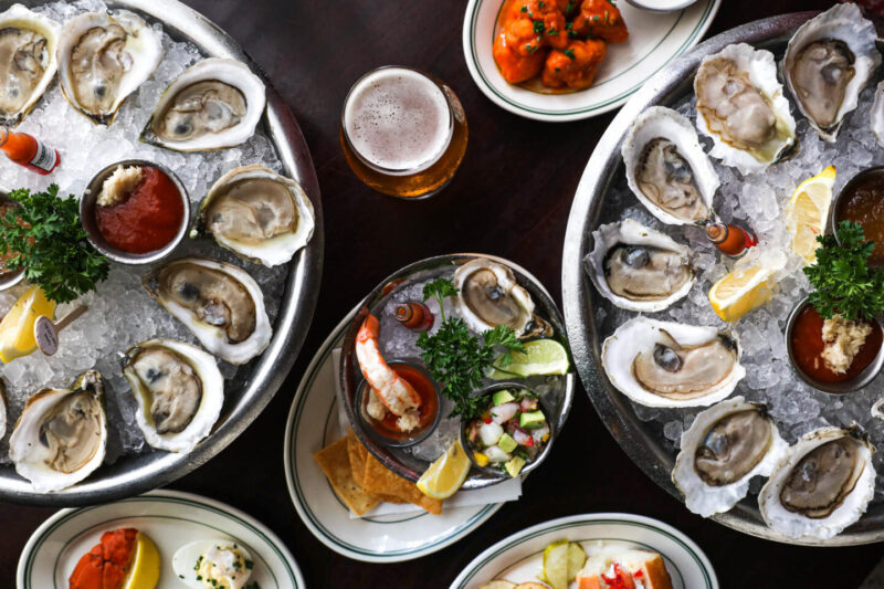 happy hour offerings from Joe's DC with full trays of oysters, appetizers, and signature beverages