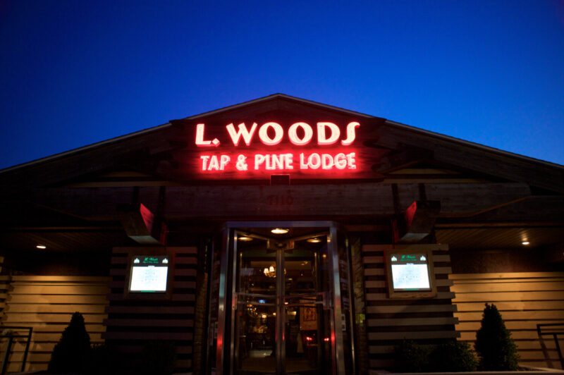 The cabin-like exterior of L. Woods Tap & Pine Lodge