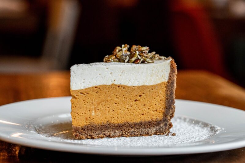 thick slice of Beatrix's Pumpkin Chiffon Pie on a white plate