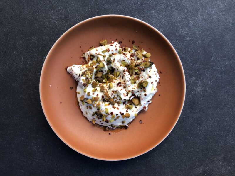 Aba Austin's whipped feta dish, with roasted pistachios and spices sprinkled on top