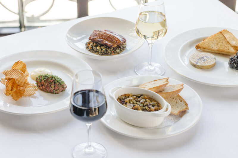 Spread of dishes and wine at Mon Ami Gabi