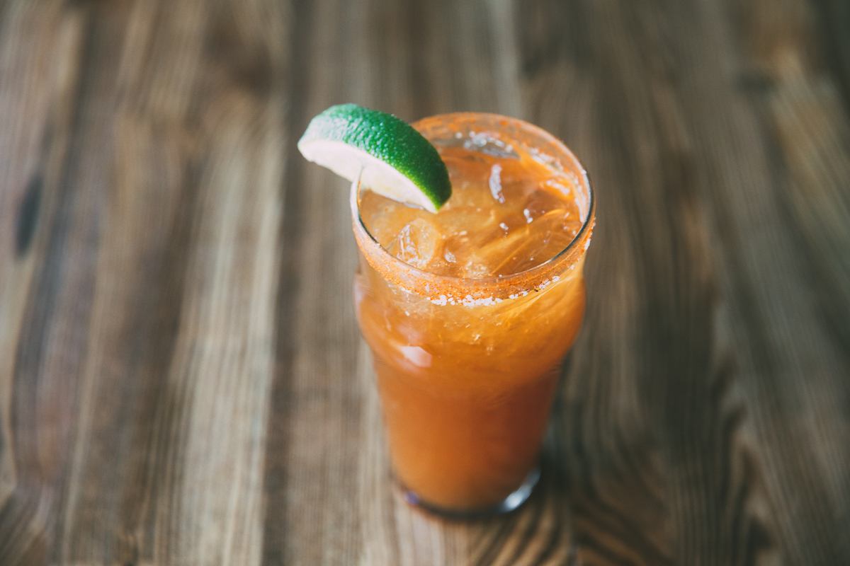 Quality Crab & Oyster Bah's Michelada with Four Letter Hot Sauce