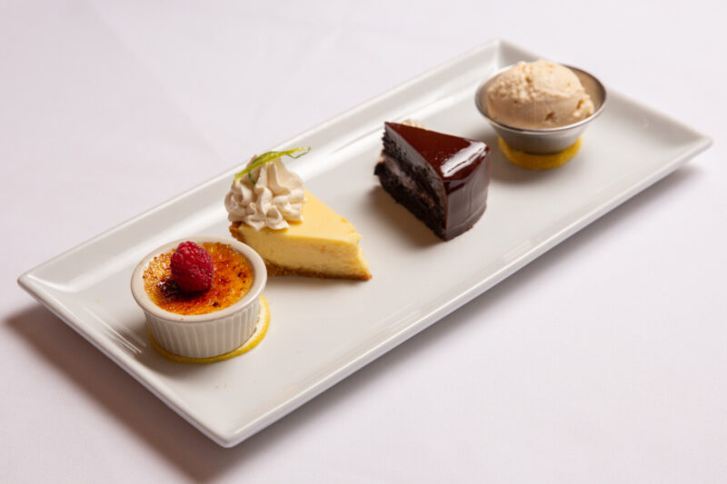 Dessert sampler from Shaw's Crab house with mini chocolate cake, mini key lime pie, mini creme brulee, and vanilla ice cream.