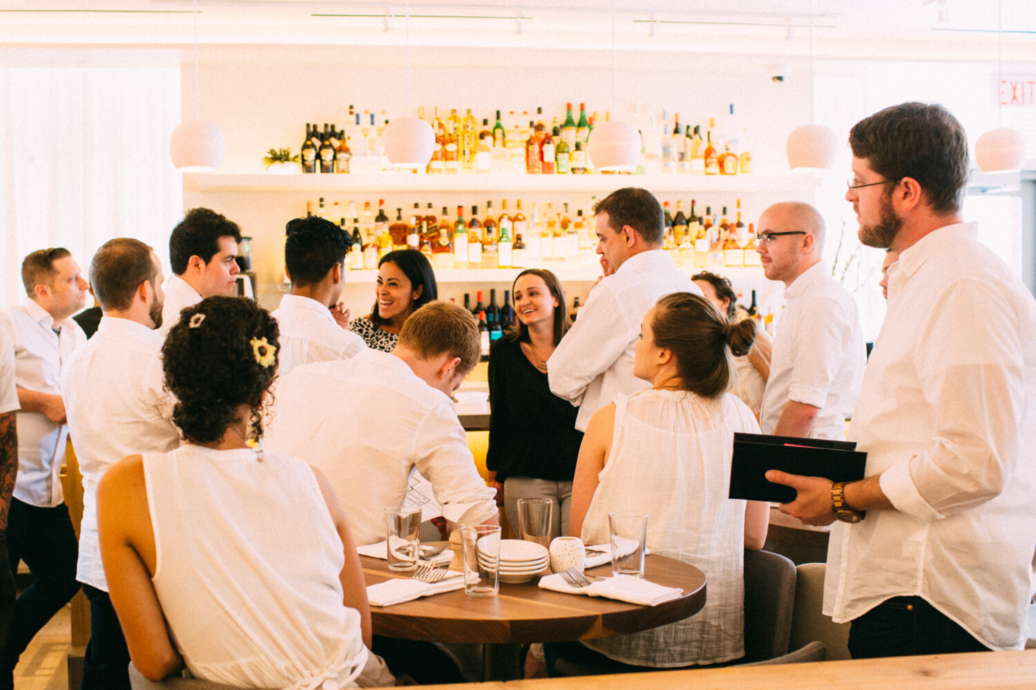 employees having a meeting at ema restaurant