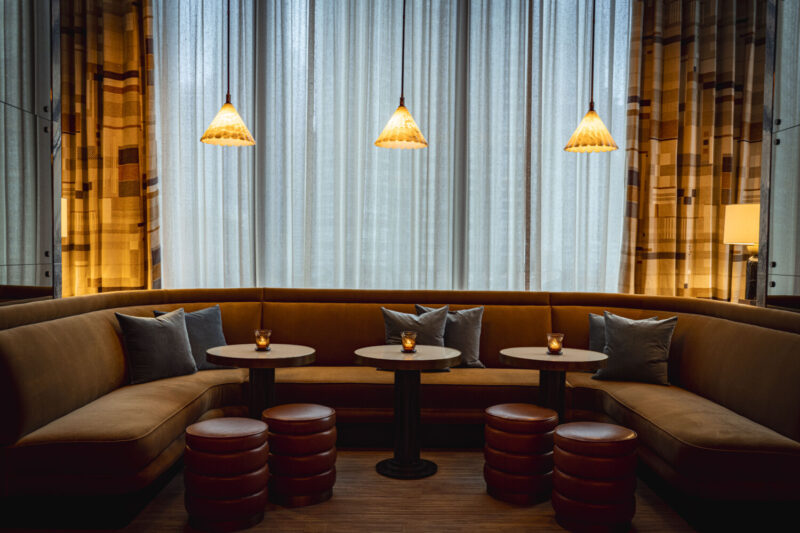 Velvet booth and leather stool seating at Bar Tre Dita