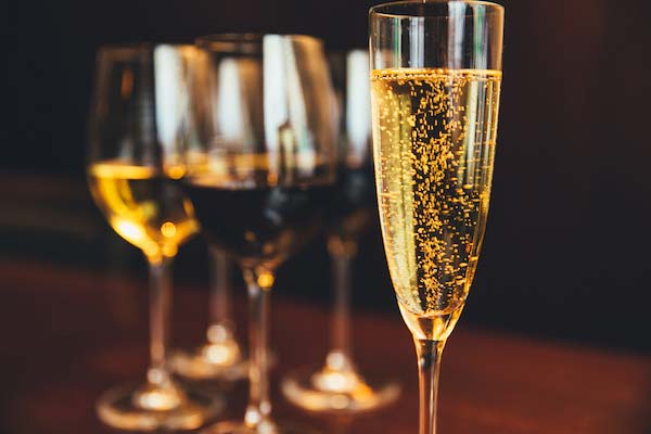 Wine and champagne glasses lined up on a table