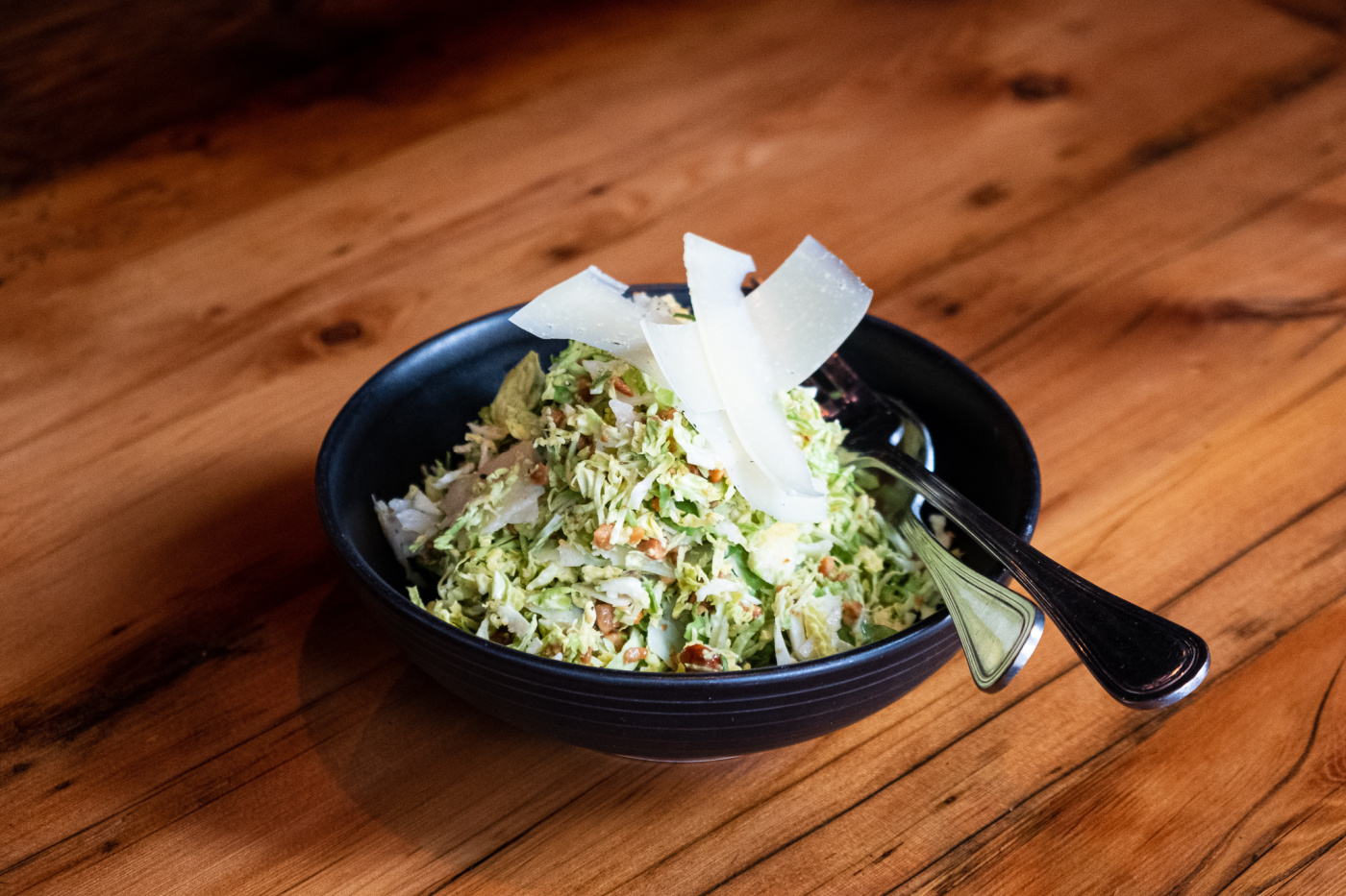 Shaved Brussels Sprouts salad topped with cheese at Lil Ba-Ba-Reeba in River North, Chicago.