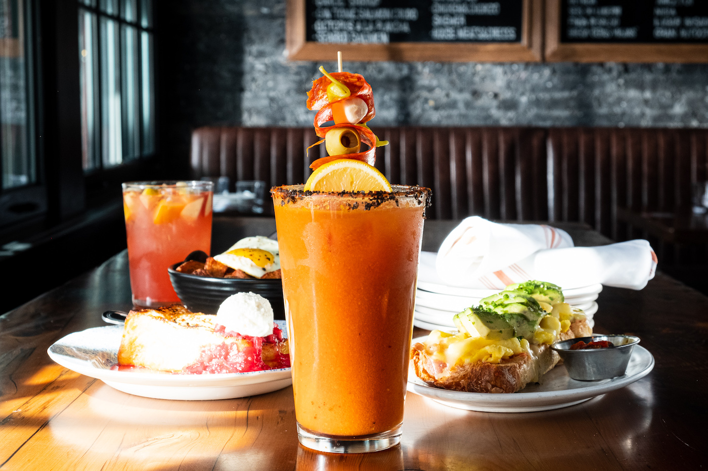 Lil' Ba-Ba-Reeba!'s bloody mary surrounded by sangria and brunch dishes.