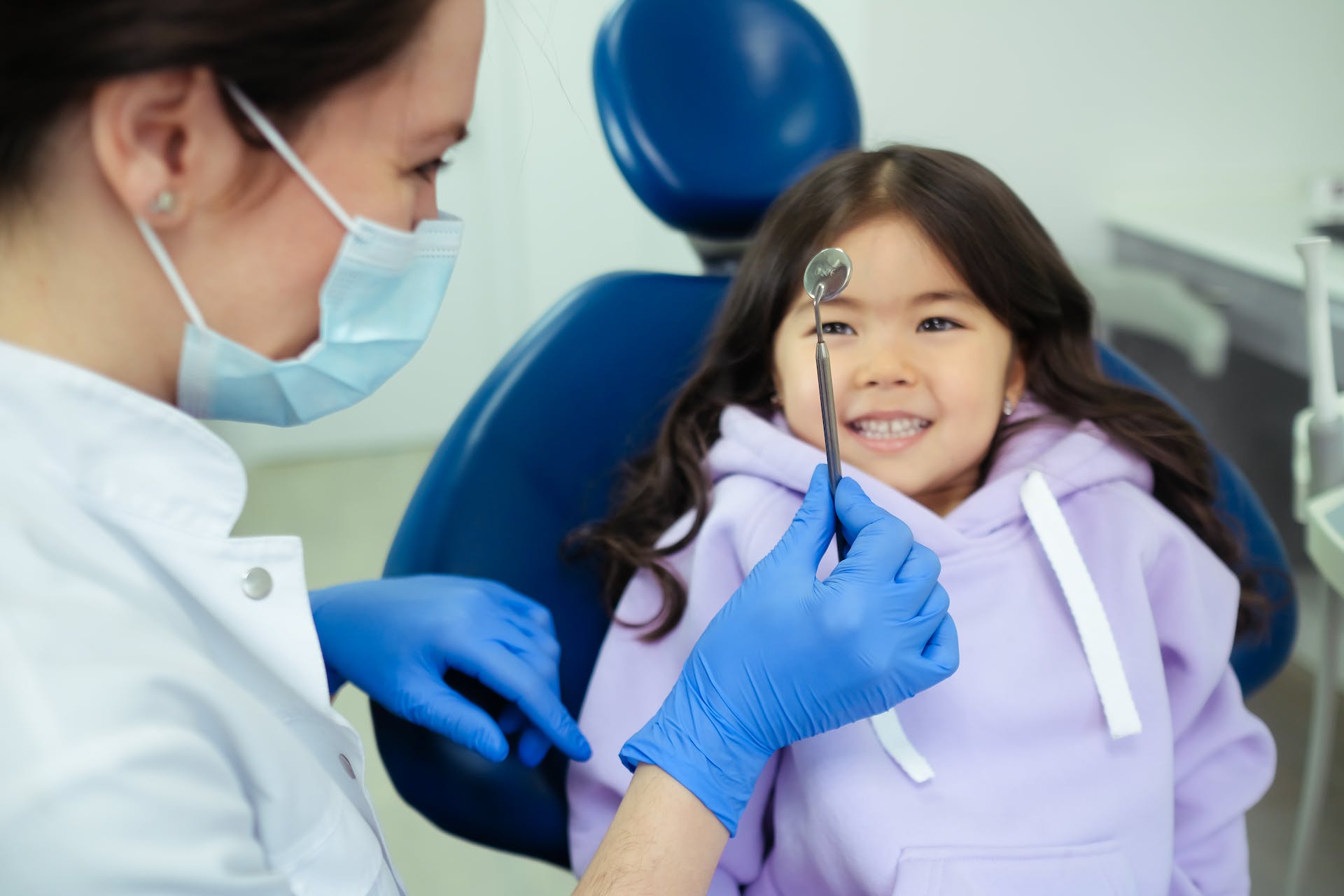 When should children visit the dentist?