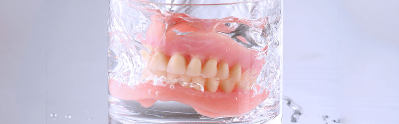 soak and keep your dentures wet