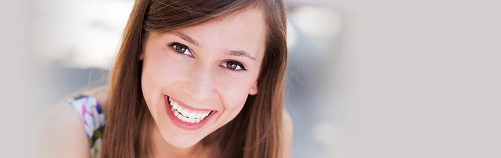 girl smiles after wisdom tooth removal