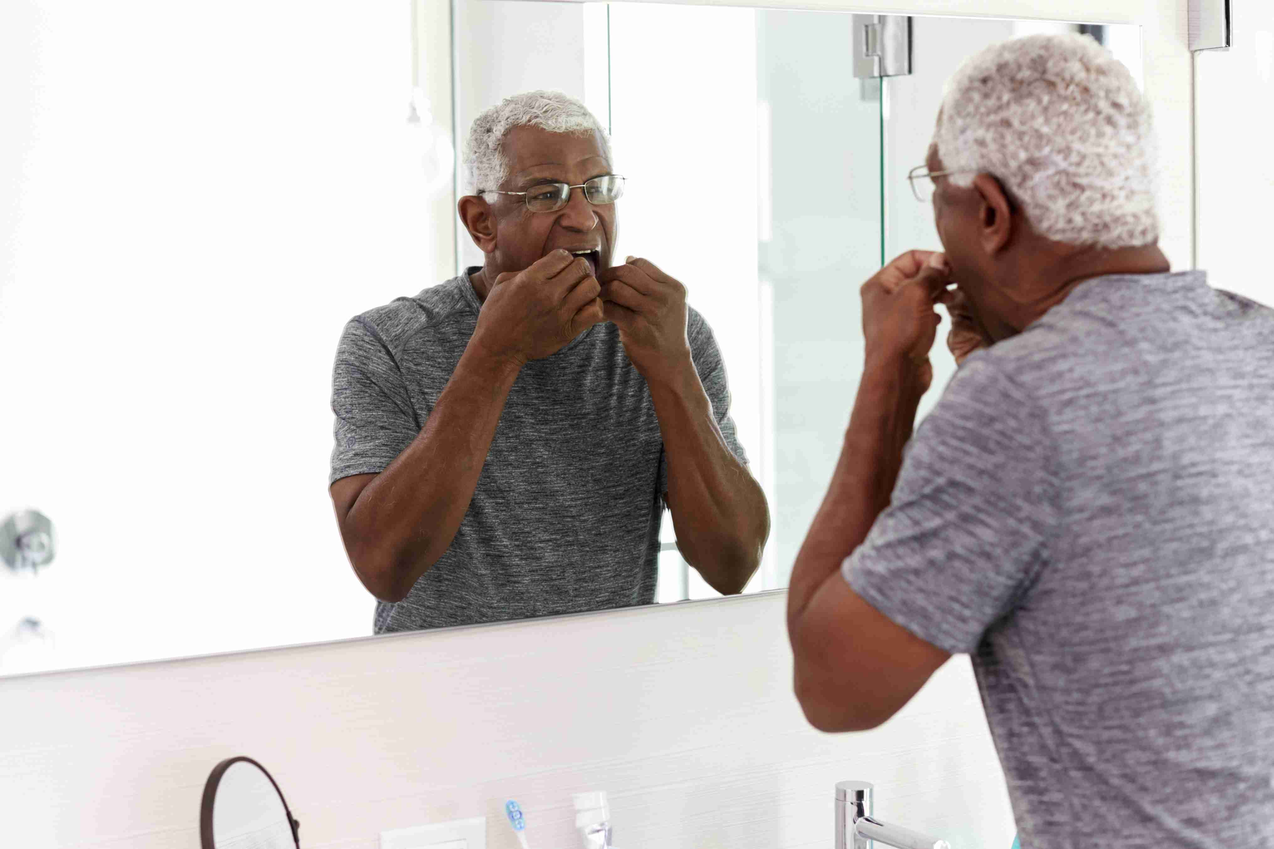 Tweed Heads man inserting a partial denture