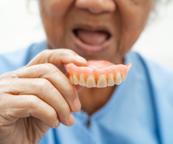How many hours a day should you wear your dentures?.