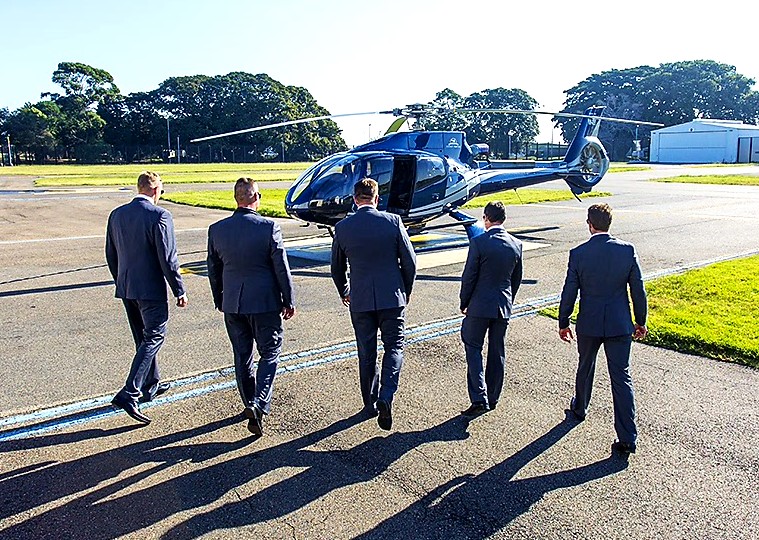 business men transferring on a helicopter