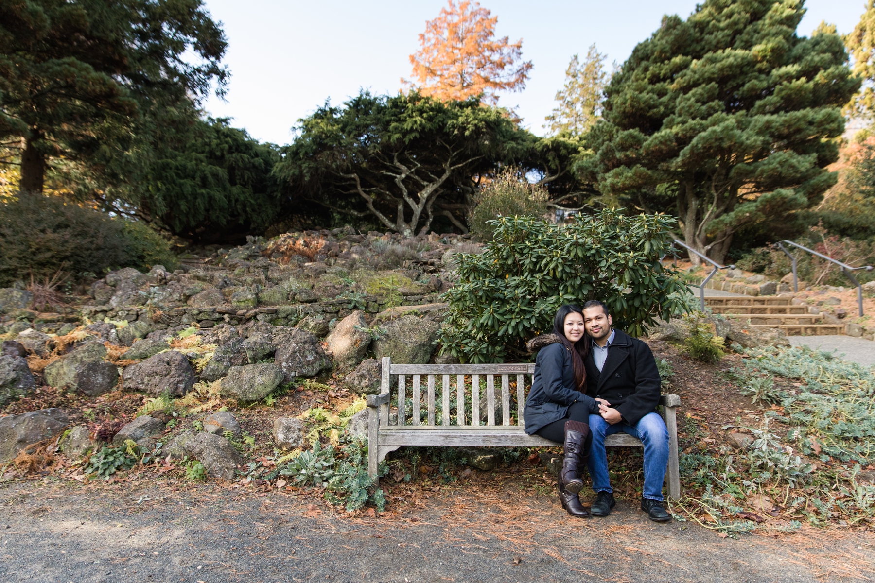 Stephanie and Naveed while sitting on Wooden-Bench