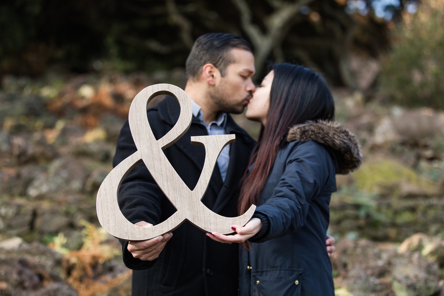 Stephanie and Naveed while holding The Wooden Letter