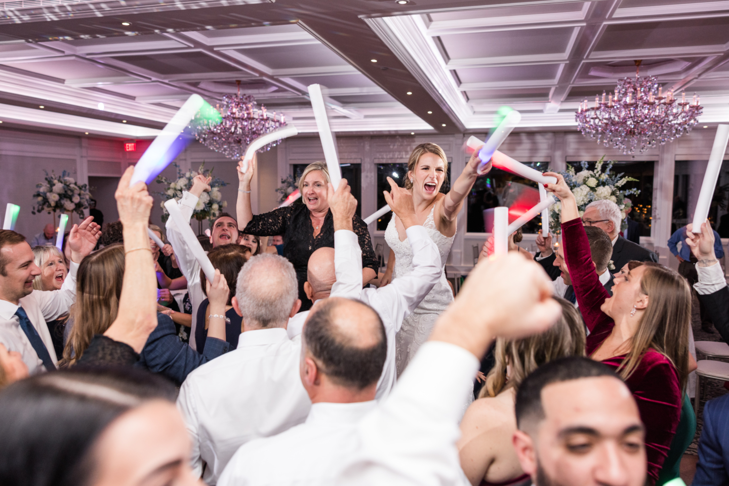 People having fun and dancing at a wedding to the music