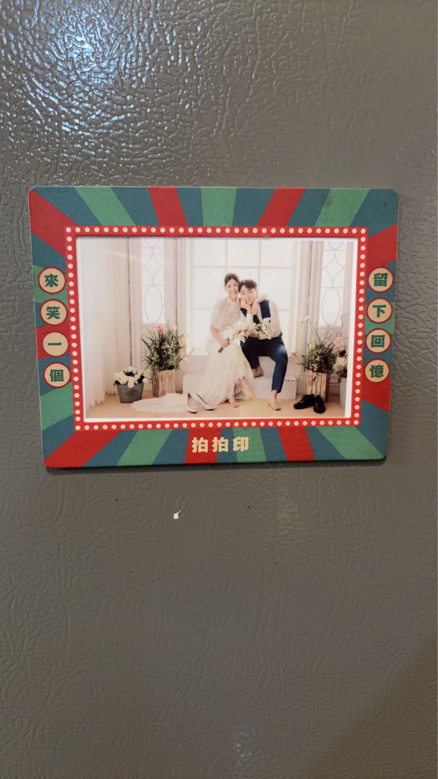 Real shot: a custom-designed magnet frame living long-term on a guest's fridge