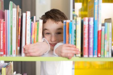 boy-reading-in-library keep kids learning over summer