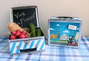 Little Passports Sam & Sofia Lunchbox filled with baguette, radish and cucumbers