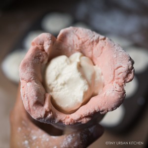 Little Passports Blog Make Your Own Mooncakes Placing Ice cream in mold with dough